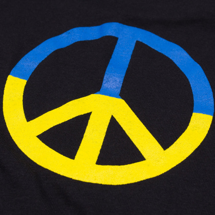 Peace For Ukraine Black T-Shirt. Sign of the Pacific placed in a sunflower. Yellow-blue colors of the Ukrainian flag. Made in Ukraine.