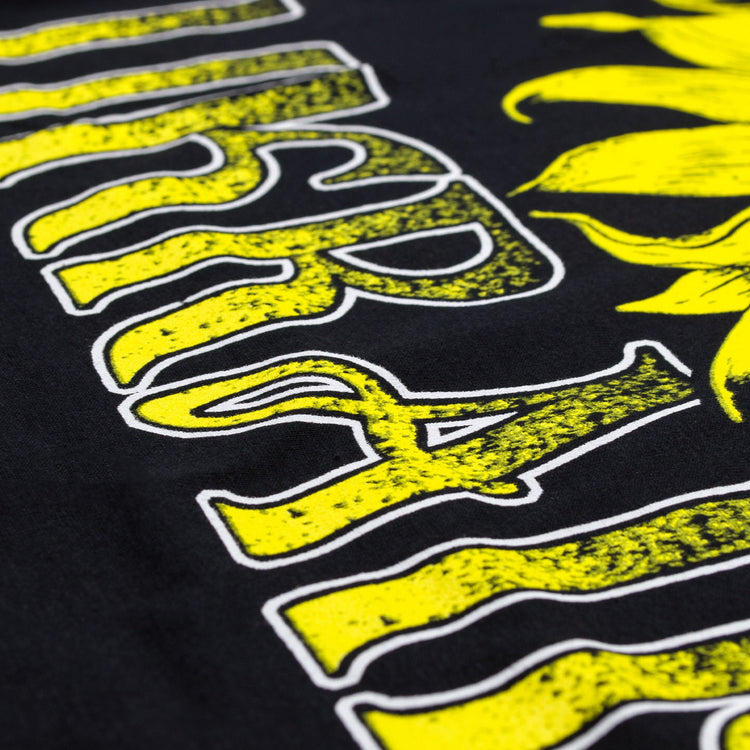 Peace For Ukraine Black T-Shirt. Sign of the Pacific placed in a sunflower. Yellow-blue colors of the Ukrainian flag. Made in Ukraine.