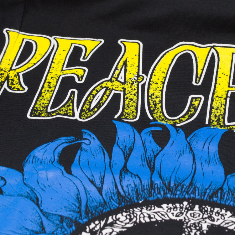 Peace For Ukraine Black T-Shirt. Sign of the Pacific placed in a sunflower. Yellow-blue colors of the Ukrainian flag. Made in Ukraine.